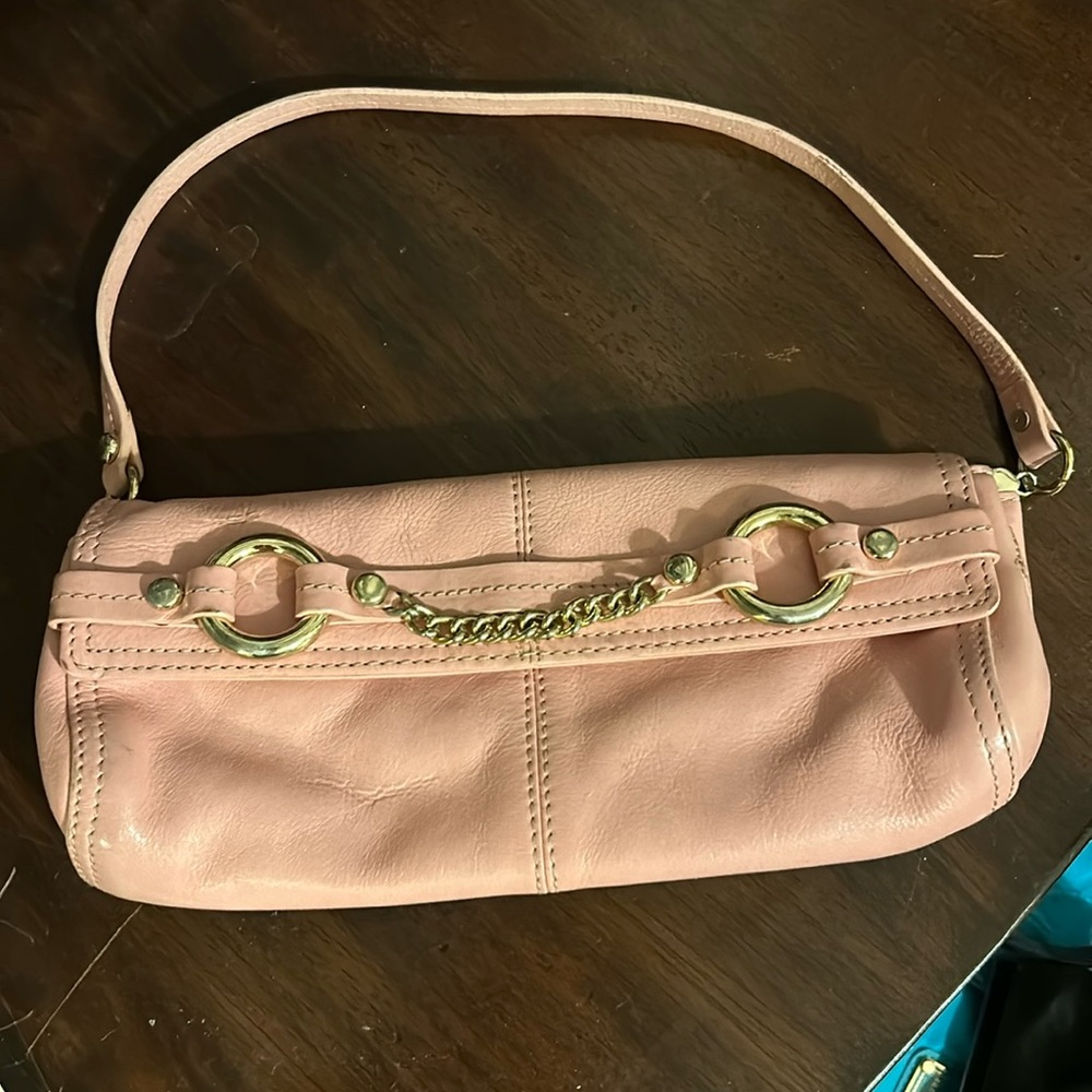 Bubblegum Pink Juicy Couture leather wristlet bag with gold hardware. So cute!